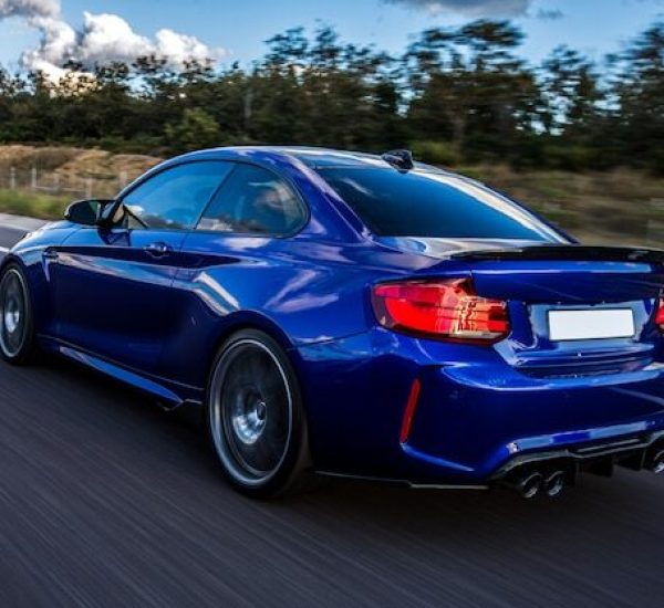 blue-car-driving-road_114579-4056